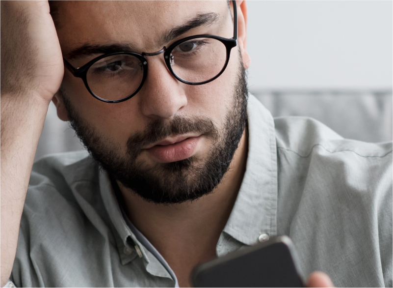 Guy looking at phone