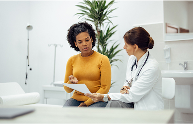 woman talking to doctor